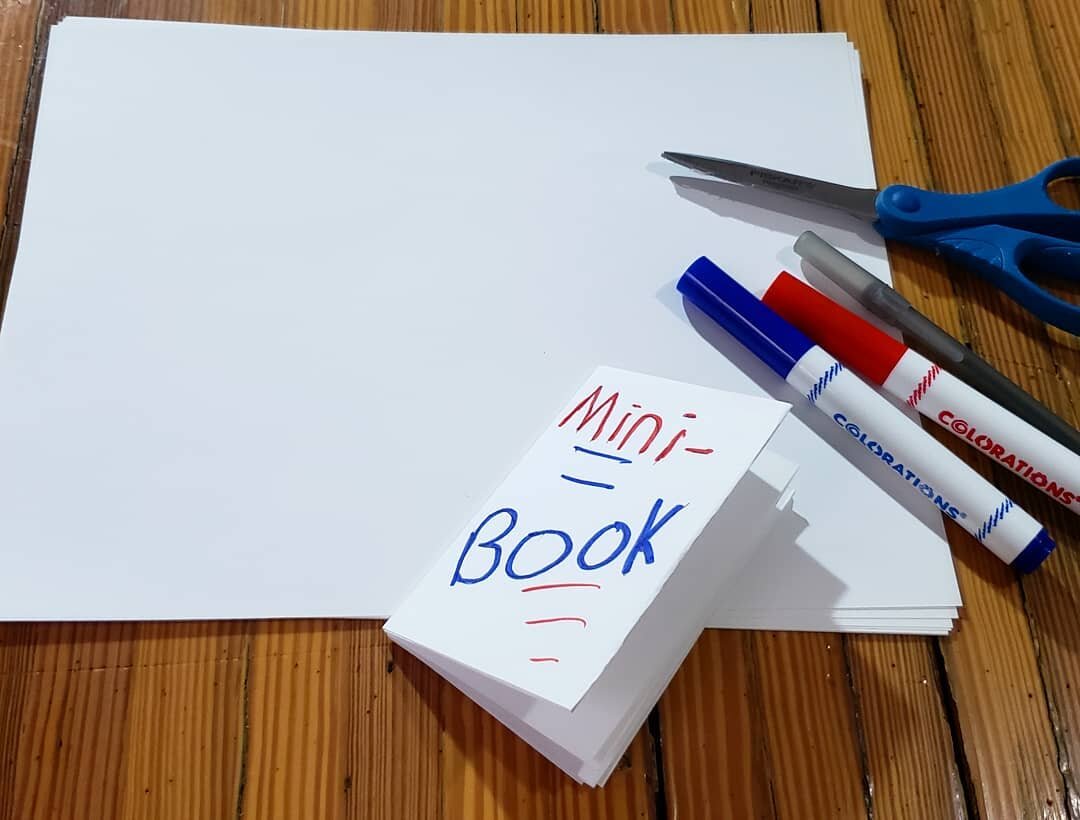 Mini-book! Getting a bit crafty for some upcoming projects.
[[IMG: Folded paper with "Mini-book" written in red and blue marker sits on a wooden table beside a stack of white printer paper, red and blue markers, and scissors.]]