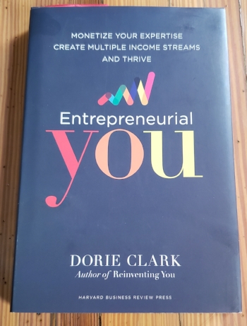 Still of Dorie Clark’s  Enrepreneurial You , hardcover edition on a wooden table